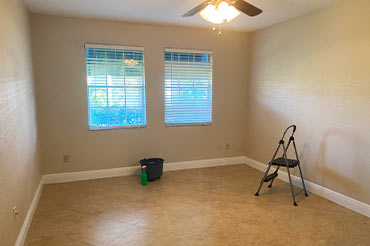 Vacant room with tools ready for window cleaning."